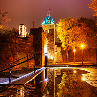 Buy canvas prints of The Porte St Louis, Quebec City, at night reflected in a puddle of water by Colin Woods