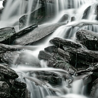 Buy canvas prints of Detail of waterfalls in a stream taken as a long time exposure by Colin Woods