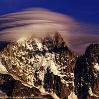 Buy canvas prints of Dramatic clouds on the Aiguille Verte in the French Alps by Colin Woods