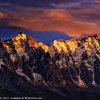Buy canvas prints of Fiery sunset light on the Chamonix Aiguilles in the French Alps by Colin Woods