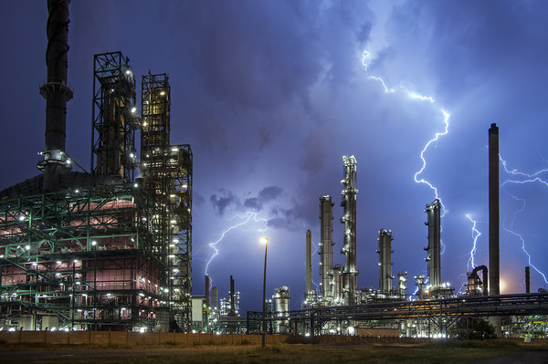 Lightning Bolts striking over Oil Refinery Picture Board by Arterra 