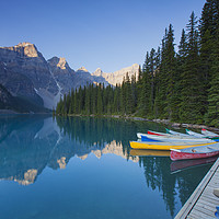Buy canvas prints of Canoes at Moraine Lake by Arterra 