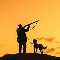 Buy canvas prints of Hunter with Dog at Sunset by Arterra 