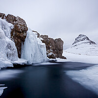 Buy canvas prints of Frozen Waterfall Kirkjufellsfoss in Winter, Iceland by Arterra 