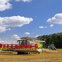 Buy canvas prints of Combine Harvester and Tractor by Arterra 