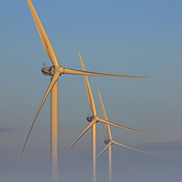 Buy canvas prints of Three Wind Turbines in the Mist by Arterra 