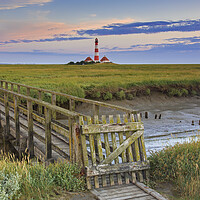 Buy canvas prints of Footbridge and Lighthouse Westerheversand at Eiderstedt, Germany by Arterra 