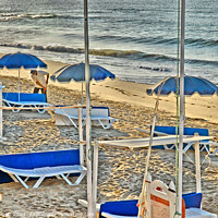 Buy canvas prints of Deckchairs On Beach in Portugal by Philip Gough