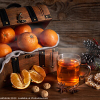 Buy canvas prints of Hot tea and oranges in a wooden chest by Ragnar Lothbrok