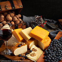 Buy canvas prints of Variety of cheese on a wooden board by Ragnar Lothbrok