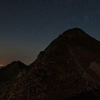 Buy canvas prints of Mountains and stars above at night by Ragnar Lothbrok