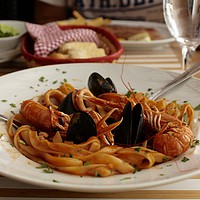 Buy canvas prints of Seafood pasta served by Barbara Vizhanyo