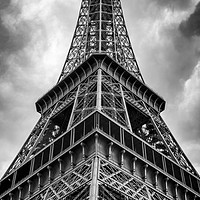 Buy canvas prints of Low angle view of the Eifel Tower on a cloudy day by George Cairns