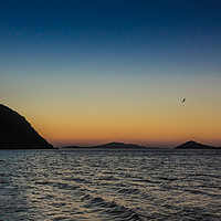 Buy canvas prints of The sun rises over the Greek island of Patmos by George Cairns