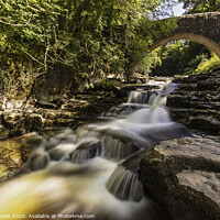 Buy canvas prints of The Majestic Beauty of Cauldron Falls by John Carson