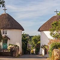 Buy canvas prints of Charming Thatched Round Houses by Kevin Snelling
