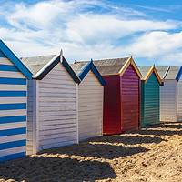 Buy canvas prints of Bright and Vibrant Seaside Cabins by Kevin Snelling