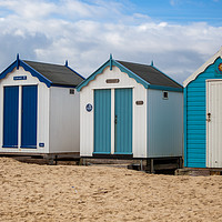 Buy canvas prints of Colourful Seaside Shelters by Kevin Snelling