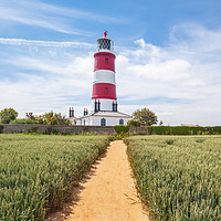 Buy canvas prints of Happisburgh lighthouse on a summers day by Kevin Snelling