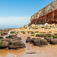 Buy canvas prints of Majestic Cliffs Over Seaside Rocks by Kevin Snelling