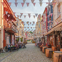 Buy canvas prints of Vibrant Kapana Flags Cobblestones and More by Kevin Snelling