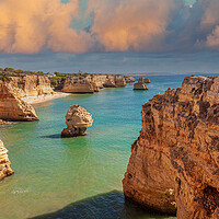 Buy canvas prints of Majestic Cliffs Overlooking Marinha Beach by Kevin Snelling