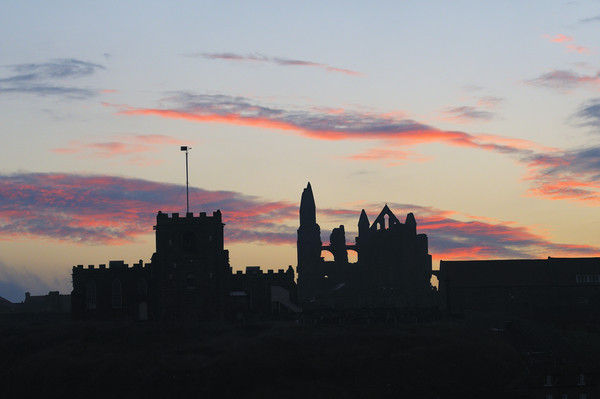 Whitby Abbey and St Mary's Church at sunrise Picture Board by Chris Harris