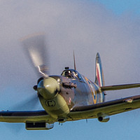 Buy canvas prints of Head on Spitfire flyby by Tom Dolezal