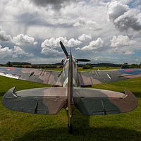 Buy canvas prints of Spitfire under a Kentish sky by Tom Dolezal