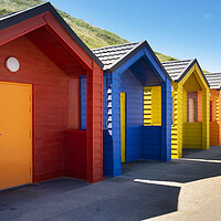 Buy canvas prints of Happy days, Saltburn beach huts colour explosion by Jeanette Teare