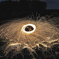 Buy canvas prints of Fire Spinning At Broken Scar Weir by Paul Welsh