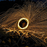 Buy canvas prints of Fire Spinning At Broken Scar Weir by Paul Welsh