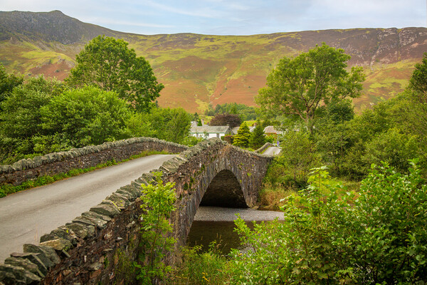 Bridge over small river at Grange in Lake District Picture Board by Steve Heap