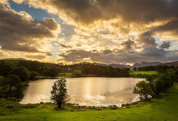 Sunset at Loughrigg Tarn in Lake District Picture Board by Steve Heap