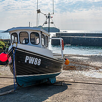 Buy canvas prints of Fishing boat in old harbour at Mullion Cove in Cornwall by Steve Heap