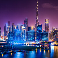Buy canvas prints of Glowing Dubai Skyline at Night by Steve Heap