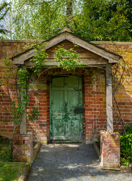 Painted green door and porch in walled garden wall Picture Board by Steve Heap