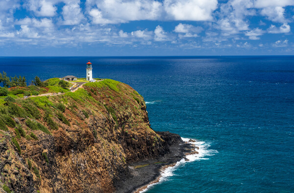 Kilauae lighthouse on headland against blue sky on Kauai Picture Board by Steve Heap