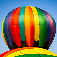 Buy canvas prints of Colorful hot air balloon rising above another with by Steve Heap