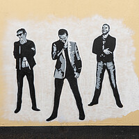 Buy canvas prints of Wall painting of the pop group Muse  by Steve Heap