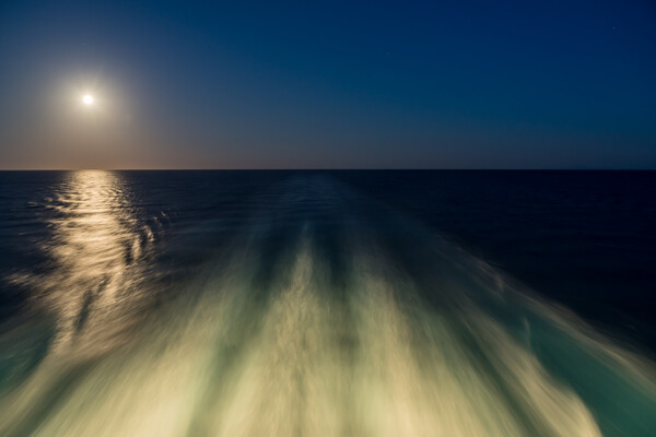 Moon over the wake of cruise ship travelling at speed Picture Board by Steve Heap