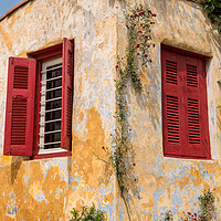 Buy canvas prints of Red shutters on window in ancient district of Anafiotika in Athe by Steve Heap
