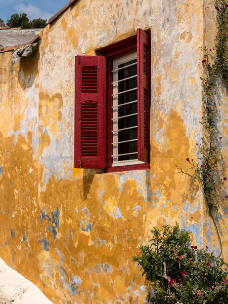 Red shutters on window in ancient district of Anafiotika in Athe Picture Board by Steve Heap