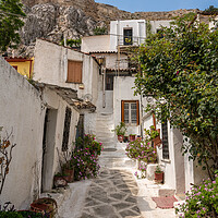 Buy canvas prints of Narrow street in ancient residential district of Anafiotika in A by Steve Heap