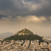 Buy canvas prints of Lycabettus hill rises above Athens on stormy day by Steve Heap