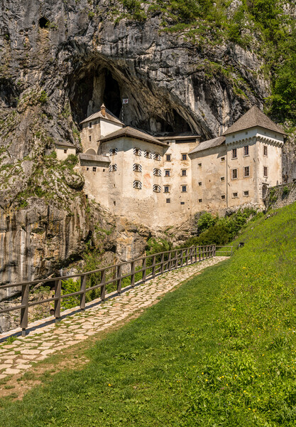 Predjama castle built into a cave in Slovenia Picture Board by Steve Heap
