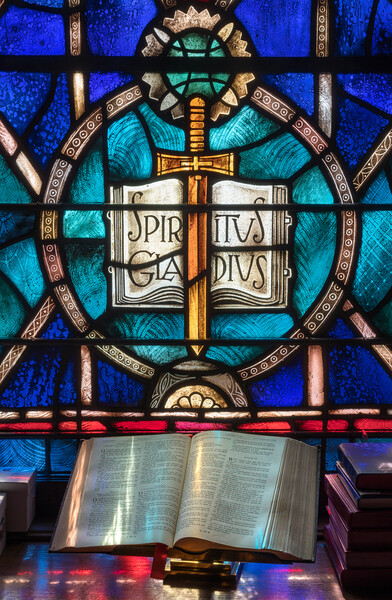 Light from stained glass window falls on open bible in american  Picture Board by Steve Heap