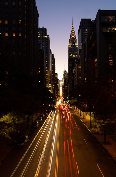 Manhattanhenge when the sun sets along 42nd street in NY Picture Board by Steve Heap