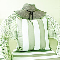 Buy canvas prints of Hat on wicker chair with cushion by David Bigwood