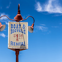 Buy canvas prints of Boat and bikes for rent by Gary Parker